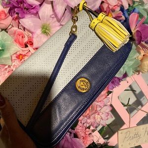 Navy blue Anne Klein bag. Small chains on purse handle. Yellow tassels.